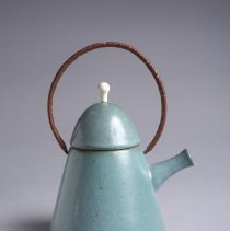 Bennington Potters teapot teal blue glaze with round wicker handle